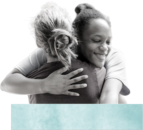 about-above-footer-image Decorative image of two girls hugging.